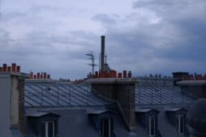 Chimneys on a roof: a blocked flue is a common cause of error C6 in Junkers boilers